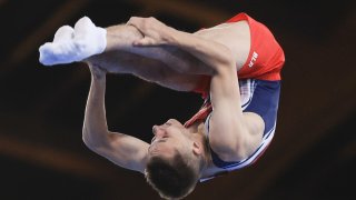 Ivan Litvinovich of Belarus competes in the men's trampoline gymnastics final during the Tokyo Olympics