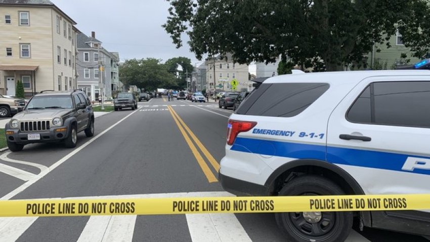 New Bedford police investigate the scene of a shooting on Nash Road on August 9, 2021.