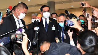 Thailand Prime Minister Prayuth Chan-ocha talks to reporters at parliament after a confidence vote on himself and five members of his Cabinet in Bangkok, Thailand, Saturday, Sept. 4, 2021.