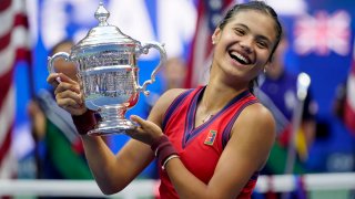 Emma Raducanu, of Britain, holds up the US Open championship trophy after defeating Leylah Fernandez, of Canada, during the women’s singles final of the US Open tennis championships, Saturday, Sept. 11, 2021, in New York.