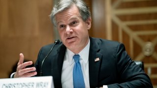 FBI Director Christopher Wray testifies before a Senate Homeland Security and Governmental Affairs Committee hearing to discuss security threats 20 years after the 9/11 terrorist attacks, Tuesday, Sept. 21, 2021 on Capitol Hill in Washington.