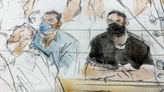 This sketch shows defendants Salah Abdeslam, right, and Mohammed Abrini in the special courtroom built for the 2015 attacks trial, Sept. 8, 2021 in Paris.