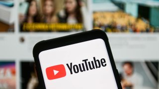 A YouTube logo seen displayed on a smartphone.
