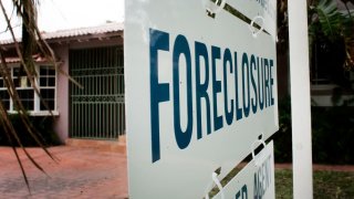 A foreclosure sign in front of a house in 2007.