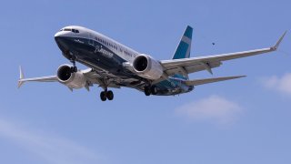 A Boeing 737 MAX airplane lands after a test flight at Boeing Field in Seattle, Washington, U.S. June 29, 2020.