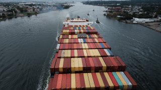 A cargo ship moves under the Bayonne Bridge as it heads into port