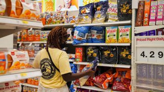 A customer selects goods at a supermarket in New York, the United States, Aug. 11, 2021.