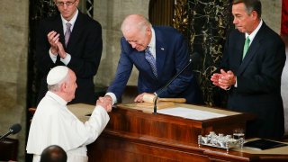 Joe Biden shakes hands with Pope Francis on Capitol Hill