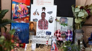 FILE - In this July 3, 2020, file photo, a makeshift memorial stands at a site across the street from where Elijah McClain was stopped by police officers while walking home in Aurora, Colo. A drug called ketamine that's injected as a sedative during arrests has drawn new scrutiny since a young Black man named Elijah McClain died in suburban Denver. An analysis by The Associated Press of policies on ketamine and cases where it was used nationwide uncovered a lack of police training, conflicting medical standards and nonexistent protocols that have resulted in hospitalizations and even deaths.