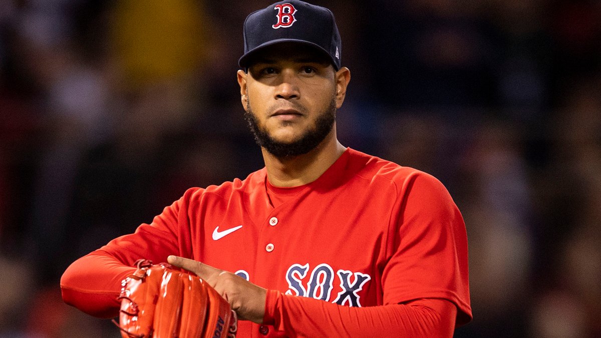 Red Sox pitcher Eduardo Rodriguez wants a ride in the laundry cart