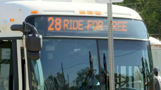 An MBTA Route 28 bus with a sign saying "Ride for Free"