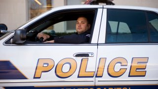 UNITED STATES - FEBRUARY 15: U.S. Capitol Police Officer Michael Riley poses for a picture outside of headquarters on D St., NE. Riley was selected Officer of the Month for February 2011 by the National Law Enforcement Officers Memorial Fund.