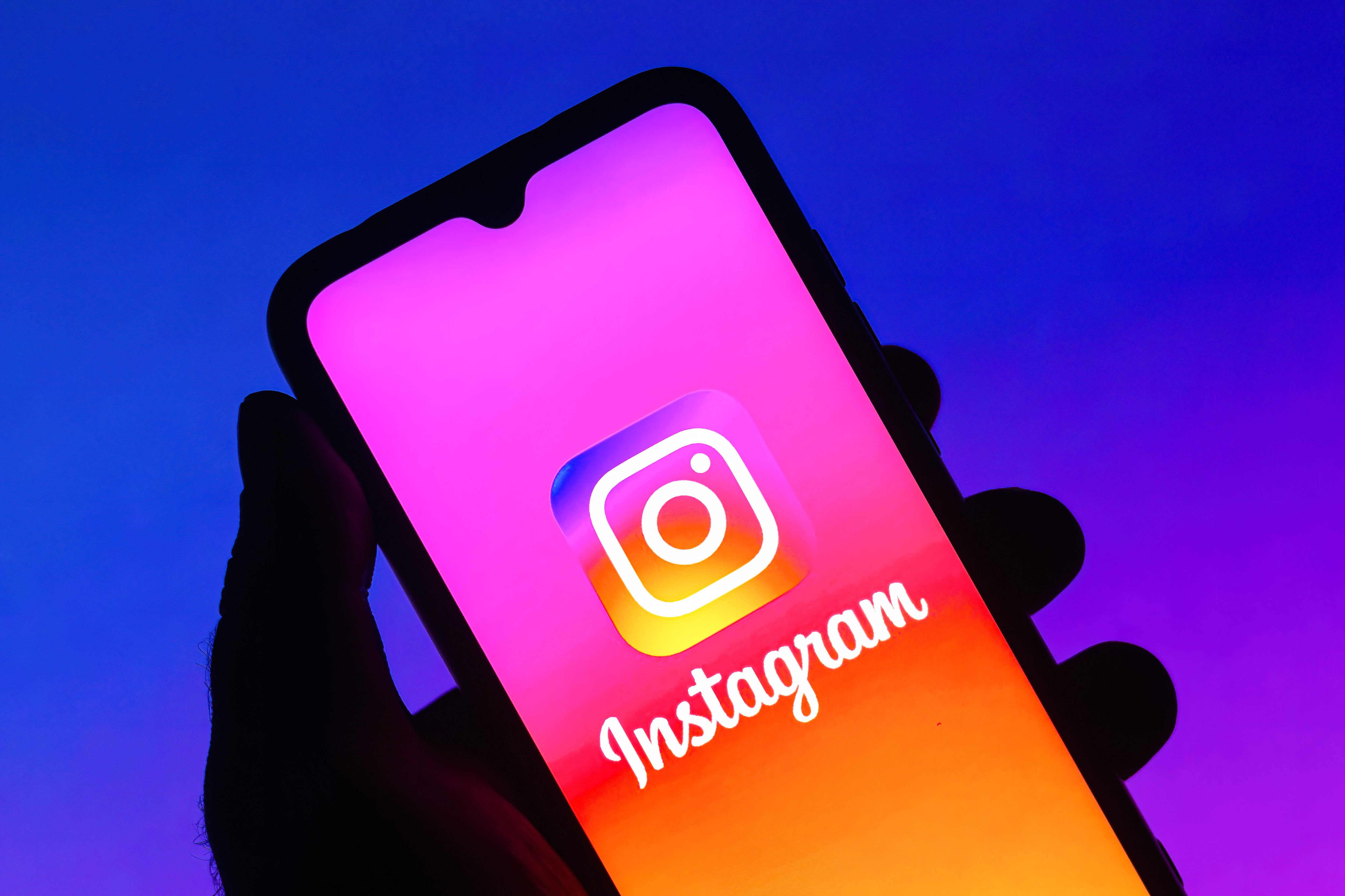 In this photo illustration the Instagram logo is seen displayed on a smartphone.