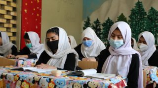 In this photo, Afghan girls attend a class in a high school in Mazar-i-Sharif, Afghanistan on October 10, 2021. High school education continues for girls in only Mazar-i-Sharif.