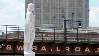 This June 23, 2020, file photo shows the Christopher Columbus statue at Worcester's Union Station after it was hit with red paint.