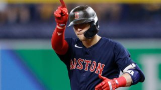 Kiké Hernandez of the Boston Red Sox reacts after hitting a double in the sixth inning against the Tampa Bay Rays during Game 2 of the American League Division Series at Tropicana Field on October 08, 2021 in St Petersburg, Florida.
