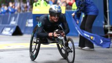 BOSTON, MASSACHUSETTS - OCTOBER 11: Marcel Hug of Switzerland crosses the finish line to win the men's wheelchair race during the 125th Boston Marathon on October 11, 2021 in Boston, Massachusetts. (Photo by Maddie Meyer/Getty Images)