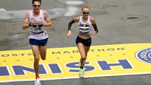 BOSTON, MASSACHUSETTS - OCTOBER 11: Shalane Flanagan of the United States crosses the finish line during the 125th Boston Marathon on October 11, 2021 in Boston, Massachusetts. (Photo by Maddie Malhotra/Getty Images)