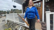 Andrea Kelley outside of her home with her Louisville Slugger bat