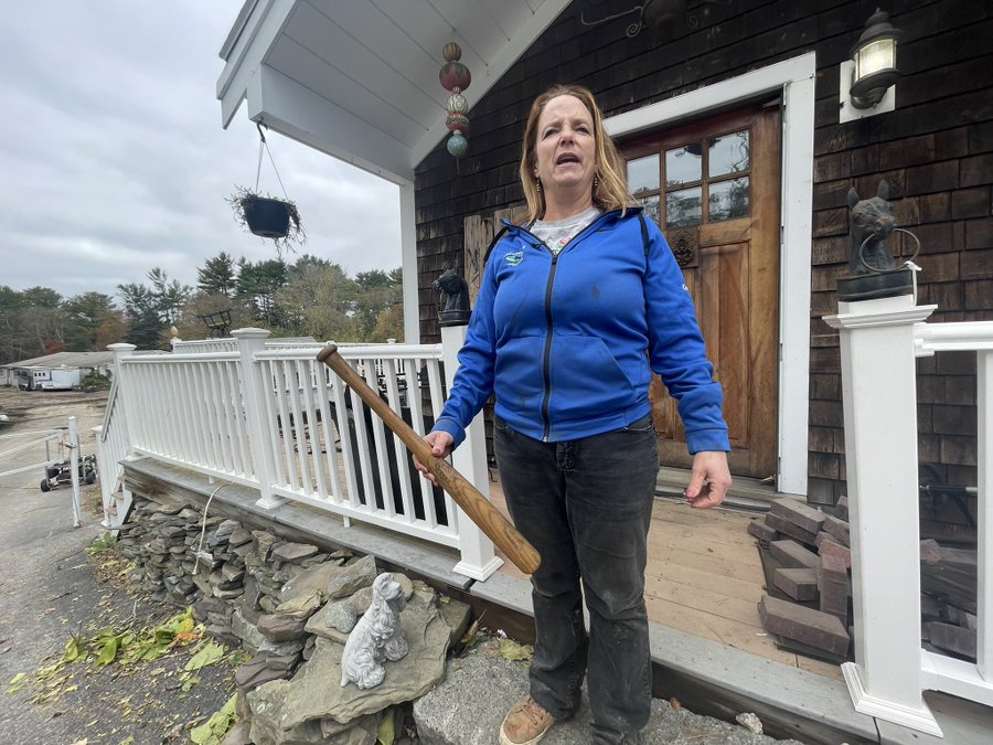 Andrea Kelley outside of her home with her Louisville Slugger bat