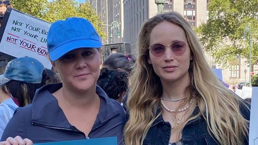 Pregnant Jennifer Lawrence Poses for Rare Pic With Amy Schumer at Women's March
