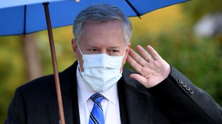 White House Chief of Staff Mark Meadows gestures as he walks back to the West Wing following an interview with FOX News outside the White House on October 25, 2020 in Washington, DC.