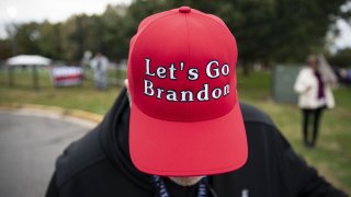 A supporter of former U.S. President Donald Trump displays a "Let's Go Brandon" hat