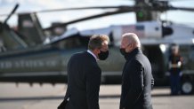 President Joe Biden is greeted by New Hampshire Gov. Chris Sununu as he steps off Air Force One upon arrival at Manchester-Boston Regional Airport in Manchester, New Hampshire, on Tuesday, Nov. 16, 2021. Biden was headed to Woodstock, New Hampshire, to promote his infrastructure bill.