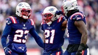 FOXBOROUGH, MASSACHUSETTS – NOVEMBER 28: Adrian Phillips #21 of the New England Patriots celebrates with teammates after a defensive play against the Tennessee Titans in the second quarter at Gillette Stadium on November 28, 2021 in Foxborough, Massachusetts. (Photo by Billie Weiss/Getty Images)