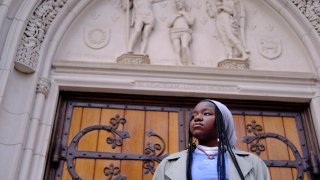 Nathalie Charles poses for a portrait outside the Princeton University Chapel