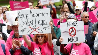 People rally in support of abortion rights at the state Capitol in Sacramento, Calif., May 21, 2019. On Wednesday Dec. 8, 2021, a group of abortion providers and advocacy groups recommended California should use public money to bring people here from other states for abortion services should the U.S. Supreme Court overturn Roe v. Wade. The report has the backing of key legislative leaders, including Senate President Pro Team Toni Atkins, a Democrat.