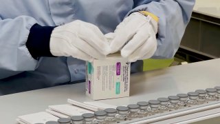 In this image from undated video provided by AstraZeneca in December 2021, a worker packages the company's Evusheld medication. On Wednesday, Dec. 8, 2021, U.S. health officials authorized the new COVID-19 antibody drug for people with serious health problems or allergies who can’t get adequate protection from vaccination.