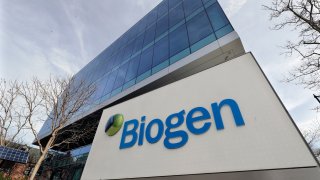 FILE - The Biogen Inc., headquarters is shown March 11, 2020, in Cambridge, Mass. Biogen is slashing the price of its Alzheimer’s treatment months after the drug debuted to widespread criticism for an initial cost that can reach $56,000 annually. The drugmaker said Monday, Dec. 20, 2021 that starting in January it will cut the wholesale acquisition cost of the drug by about 50%.