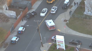 First responders at the scene of a car crash in Chelsea, Massachusetts, on Friday, Dec. 17, 2021.