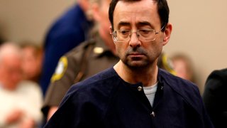 Former Michigan State University and USA Gymnastics doctor Larry Nassar addresses the court during the sentencing phase in Ingham County Circuit Court on January 24, 2018 in Lansing, Michigan. Disgraced former USA Gymnastics doctor Larry Nassar was sentenced to 40 to 175 years in prison on Wednesday for sexually abusing scores of young girls under the guise of medical treatment. "I've just signed your death warrant," Judge Rosemarie Aquilina said as she handed down the sentence after a week of gut-wrenching testimony by over 150 of Nassar's victims.