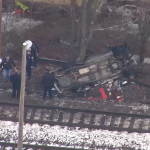 A crashed vehicle that appeared to have been involved in an incident with an Amtrak train near Haverhill, Massachusetts, Monday, Dec. 27, 2021.
