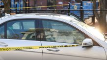 A car in Somerville being investigated after a bullet was apparently fired through its passenger and driver's side windows on Monday, Dec. 27, 2021.