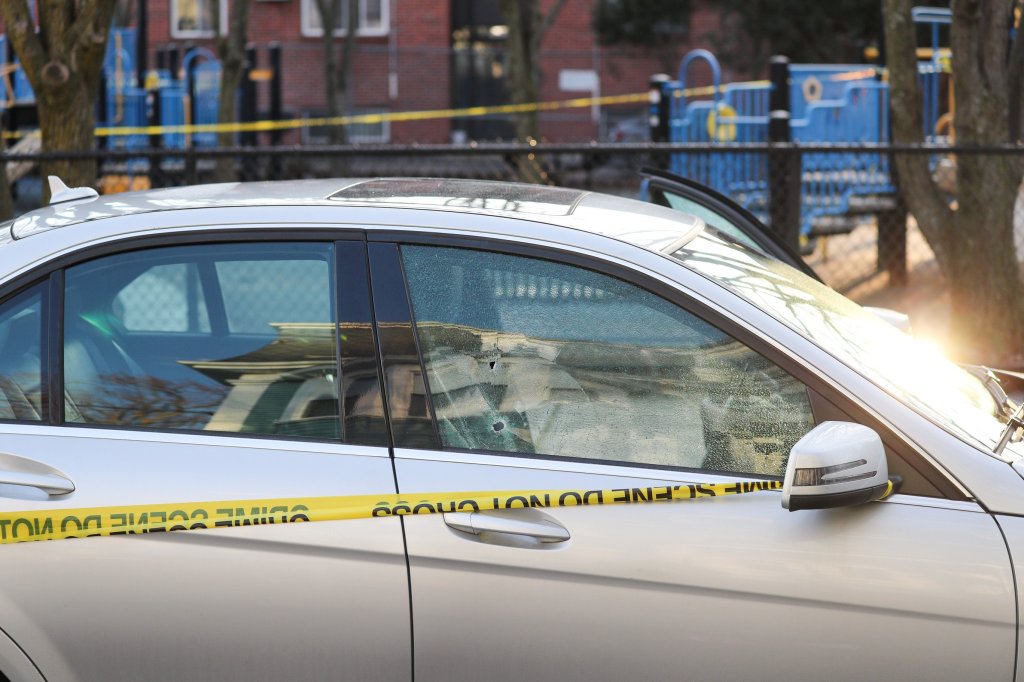 A car in Somerville being investigated after a bullet was apparently fired through its passenger and driver's side windows on Monday, Dec. 27, 2021.