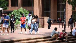 Students walk through the campus of the University of North Carolina