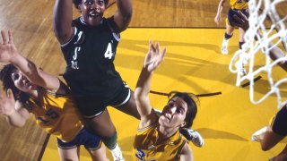 College Basketball: AIAW Final: Delta State Lusia Harris (45) in action, layup vs LSU at Williams Arena. DSU won the tournament and Harris was the MVP of the tournament. Minneapolis, MN 3/26/1977