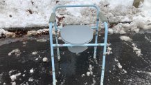 A toilet serving as a space saver after snowfall in Boston