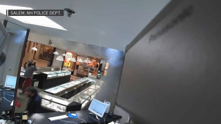 Surveillance footage of a smoke bomb being set off at a jewelry store in a Salem, New Hampshire, mall.