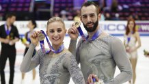 Ashley Cain-Gribble and Timothy LeDuc hold up their gold medals at the 2019 U.S. Figure Skating Championships.