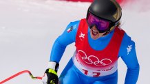 Sofia Goggia, of Italy, celebrates after finishing the Women's Downhill at the 2022 Winter Olympics, Feb. 15, 2022, in the Yanqing district of Beijing, China.