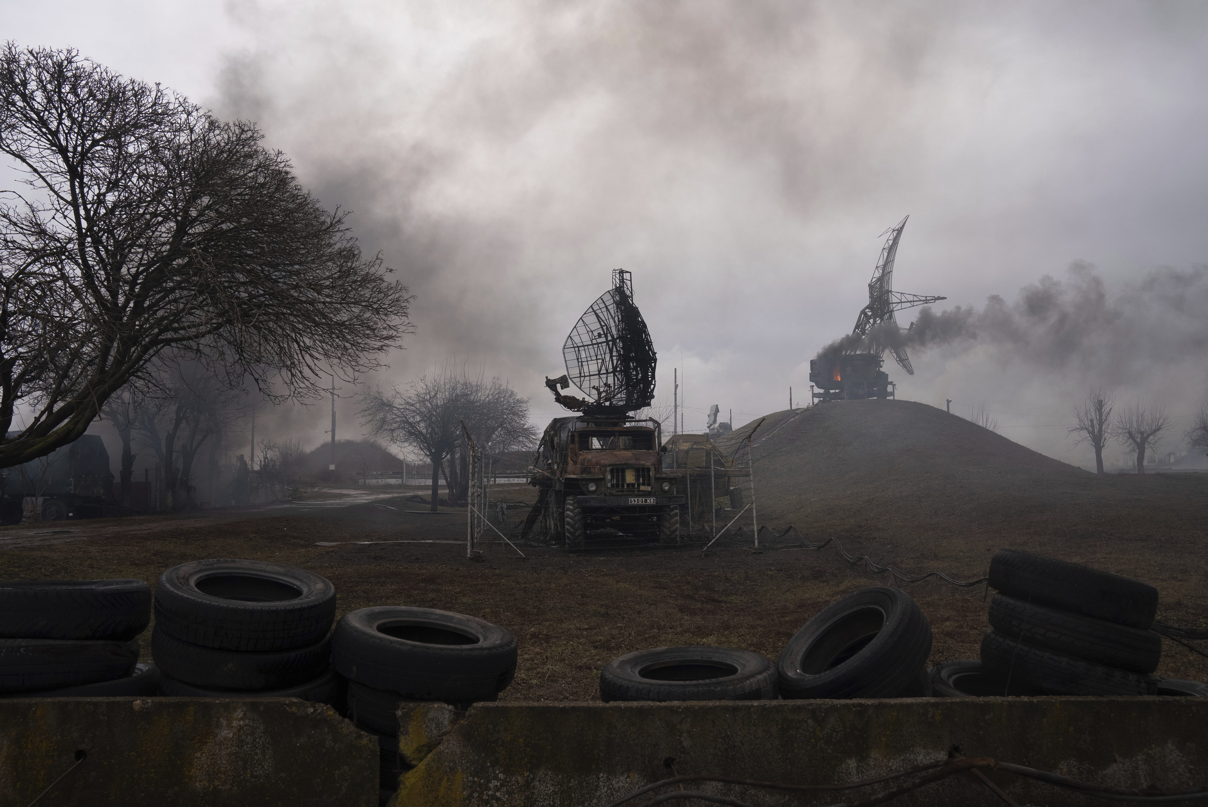 Smoke rises from an air defense base in the aftermath of an apparent Russian strike in Mariupol, Ukraine, Thursday, Feb. 24, 2022.