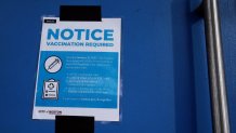 Boston, MA - January 15: A sign mandating proof of COVID vaccination hangs on a door outside the House of Blues in Boston, MA on January 15, 2022. (Photo by Craig F. Walker/The Boston Globe via Getty Images)