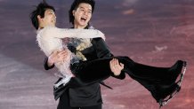 Liu Xinyu of Team China carrying Yuzuru Hanyu of Team Japan skates after the Figure Skating Gala Exhibition on day 16 of the 2022 Winter Olympics at Capital Indoor Stadium on Feb. 20, 2022, in Beijing, China.