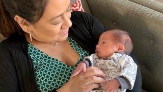 Mom Jo Anne McCusker snuggles her baby boy, Kellen, after their hospital stays.
