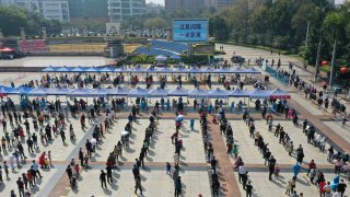 Aerial view of people queuing up for COVID-19 nucleic acid testing on February 26, 2022, in Dongguan, Guangdong province.