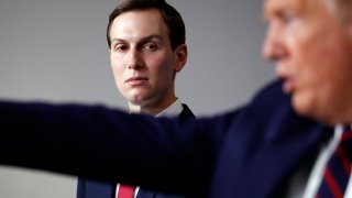 FILE - In this April 2, 2020, file photo, White House adviser Jared Kushner listens as President Donald Trump speaks during a White House press briefing in Washington. Jersey City has reached an agreement in a lawsuit by White House adviser Jared Kushner’s family’s company that claimed the city tried to sabotage a $900 million residential tower project out of political animosity toward Kushner’s father-in-law, President Donald Trump. According to Jersey City Mayor Steven Fulop, the project will go forward without a tax abatement that was at the center of the lawsuit.